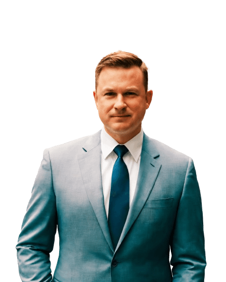 Transparent-background image of Rob Wolfe, founder of Wolfe Strategic Partners, standing confidently in a business suit.