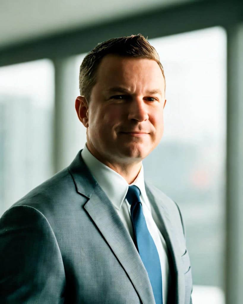 Professional headshot of Rob Wolfe, founder of Wolfe Strategic Partners, in a business suit.